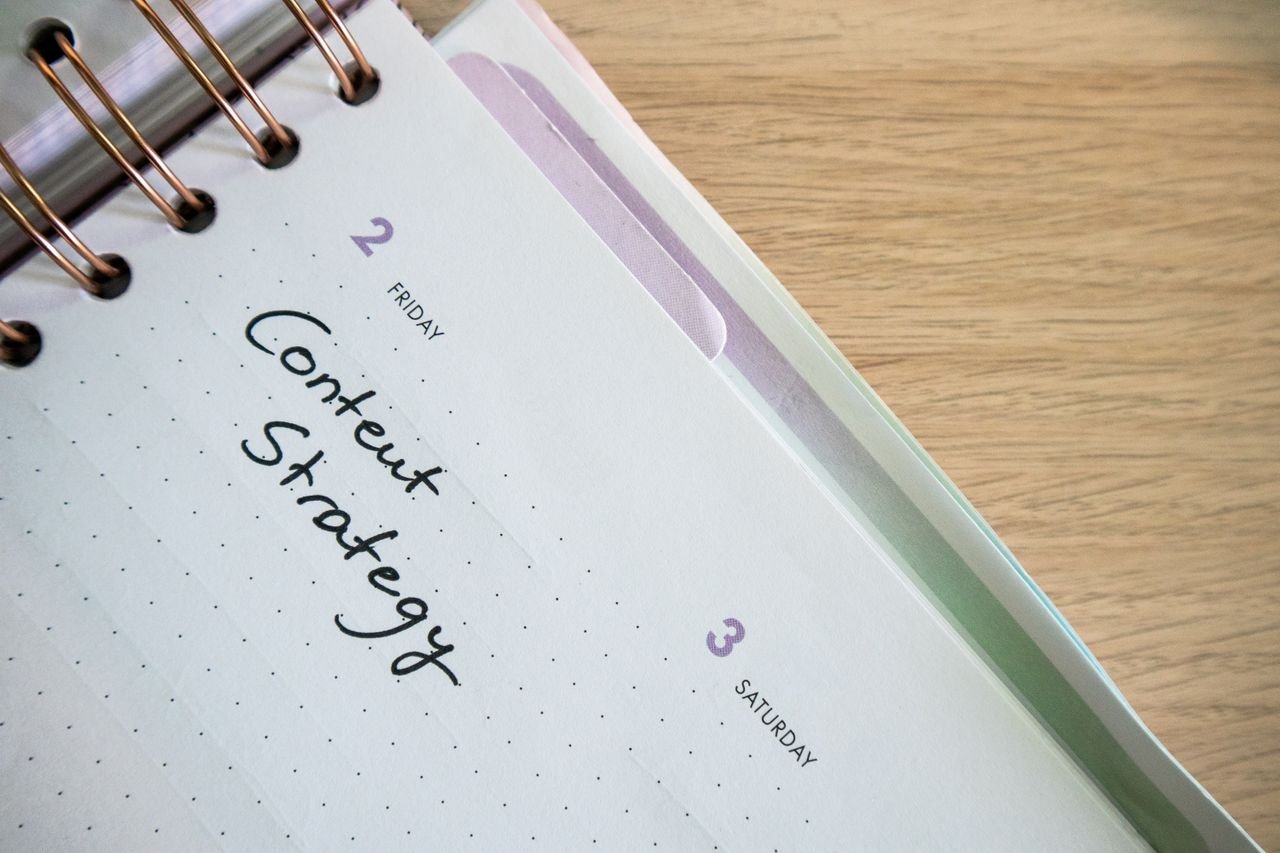 Planner page with a content strategy note handwritten on it