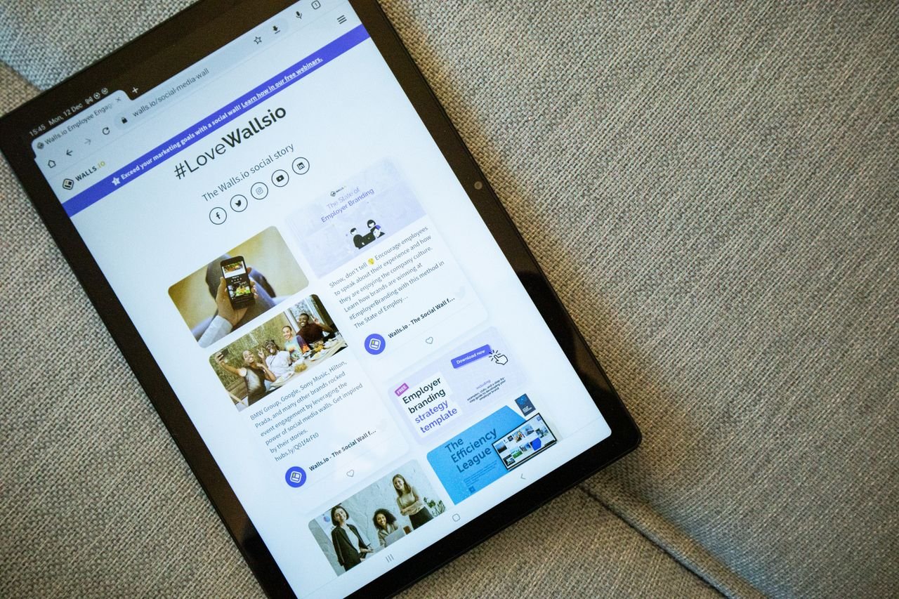 Tablet propped up showing a live social media wall